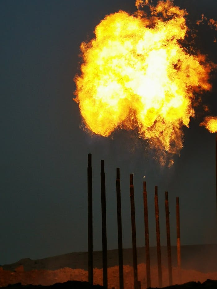 pexels photo 13247379 Intense gas flare at night illuminating industrial towers in Arumel, Iraq refinery.